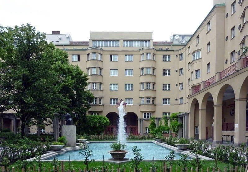 Landscaped courtyard with fountain surrounded by apartment buildings